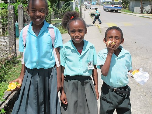 Three children in school uniforms in Punta Gorda, Toledo District, 2010